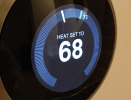 smart thermostat on wall set to 68 degrees