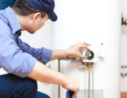 Plumber repairing an hot-water heater