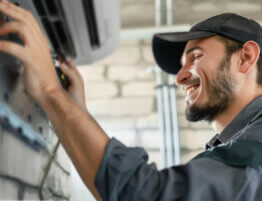 Professional installing an Air Conditioning Unit in Cleveland, OH
